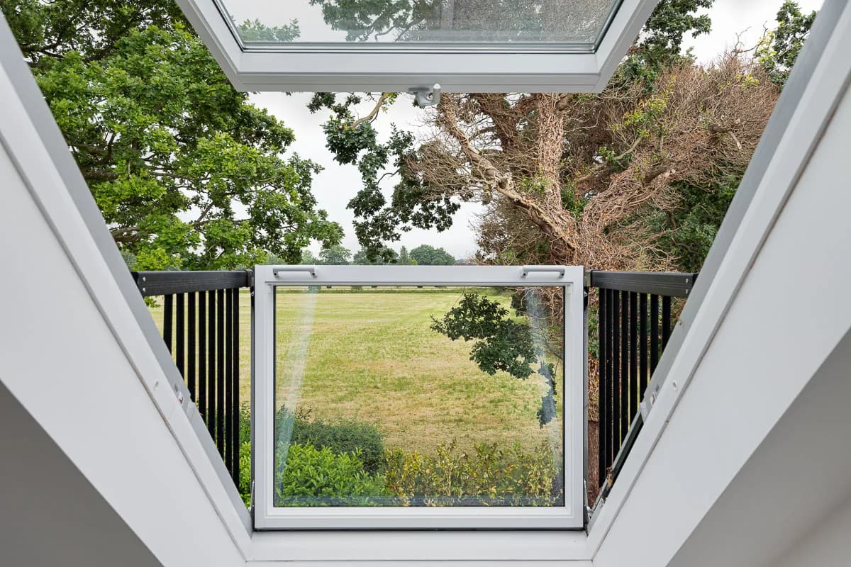 Open roof window looking out over fields