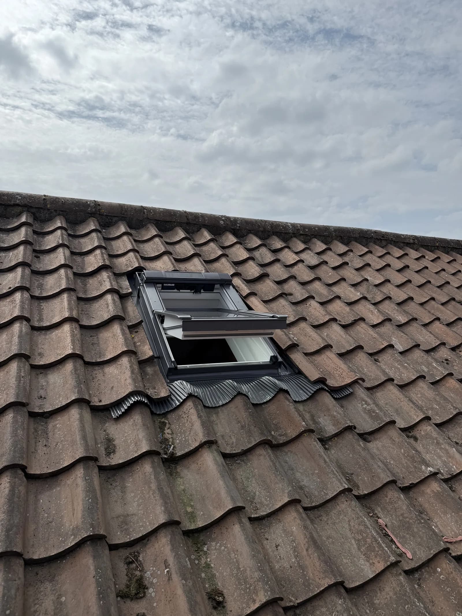 VELUX roof window close up on a tiled roof