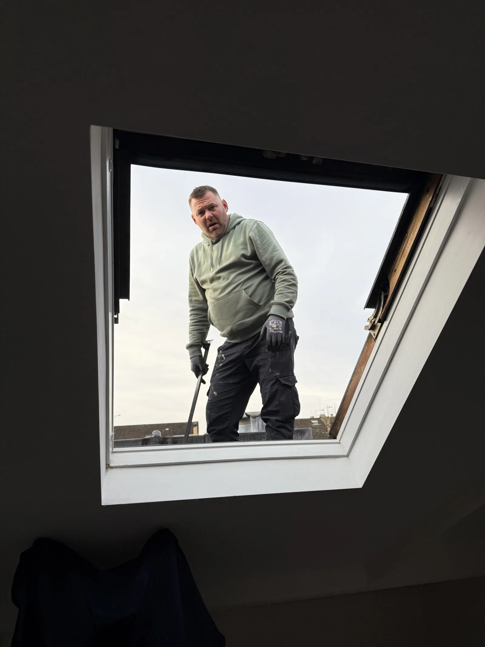 Tru Skylights installer finishing a roof window from inside
