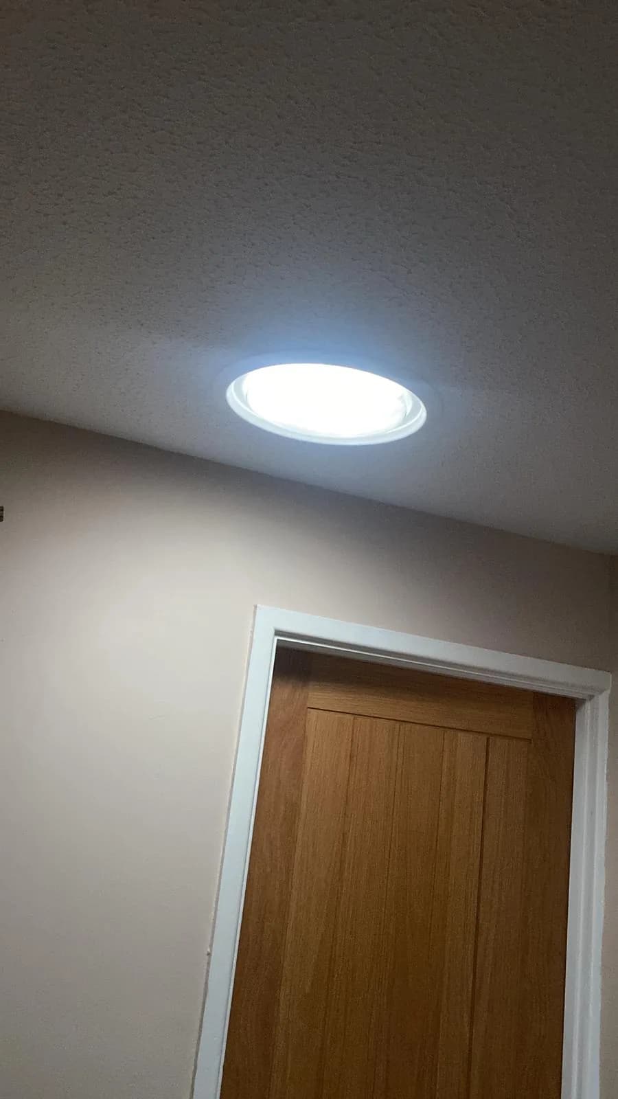 Sun tunnel diffuser lighting a hallway