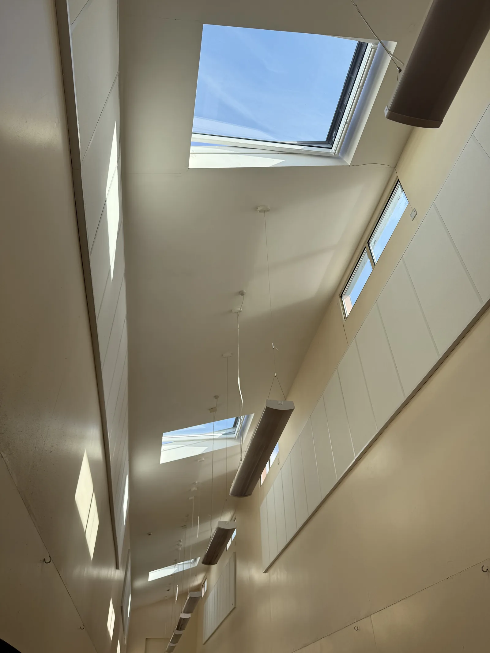 Bright loft interior lit by several roof windows
