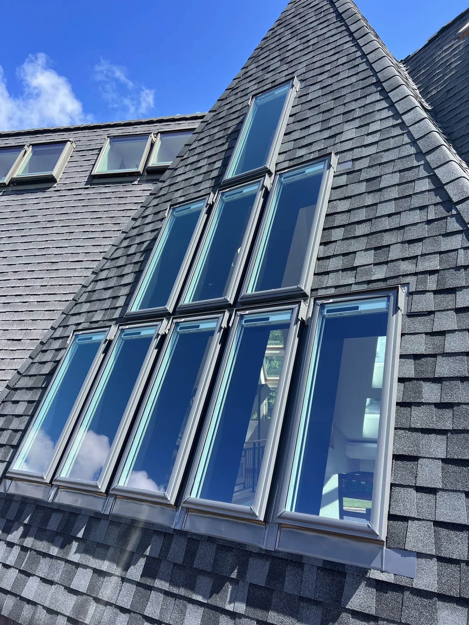 Roof windows and glazed panels on a modern house