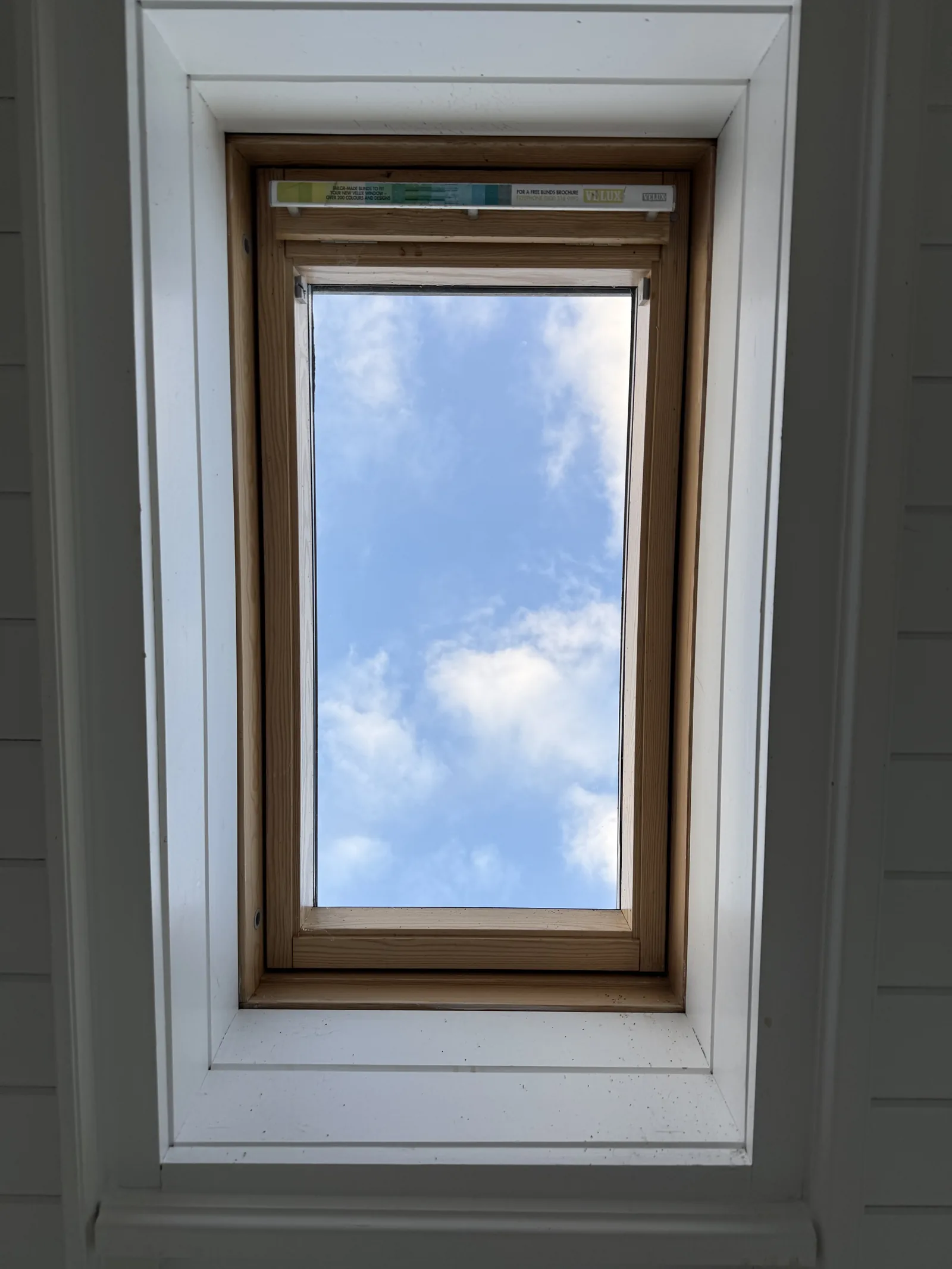 VELUX roof window with a timber surround, seen from inside
