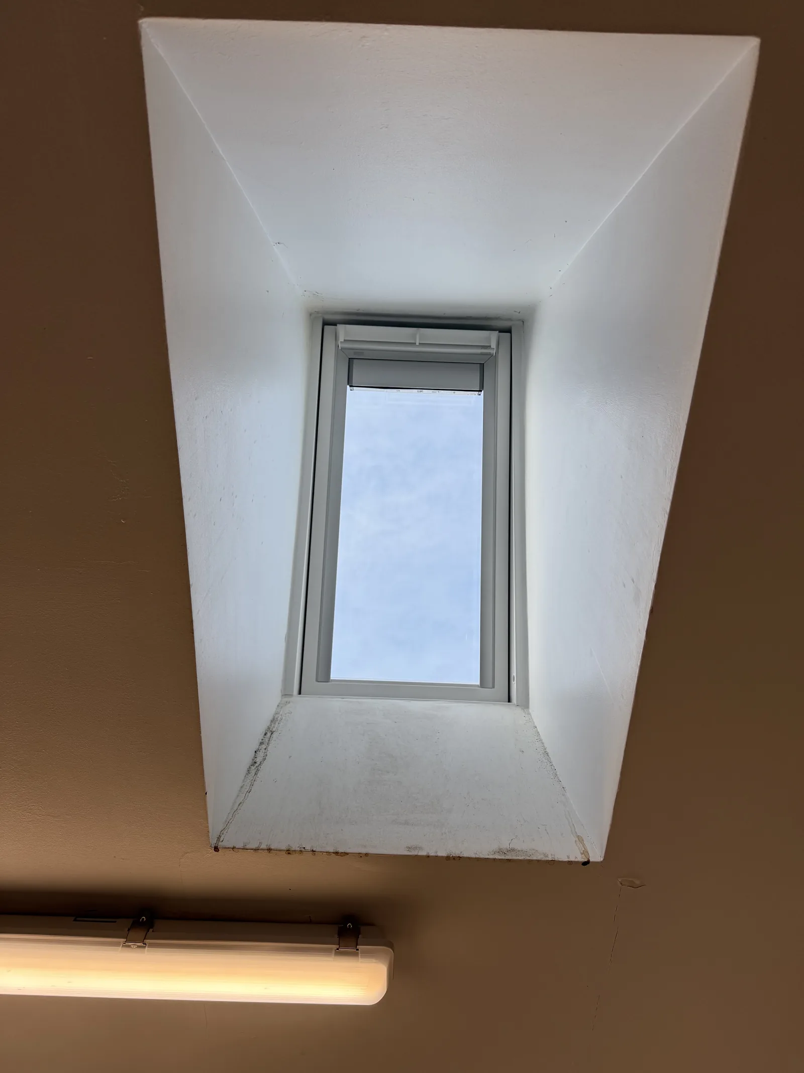 VELUX roof window in a white loft interior