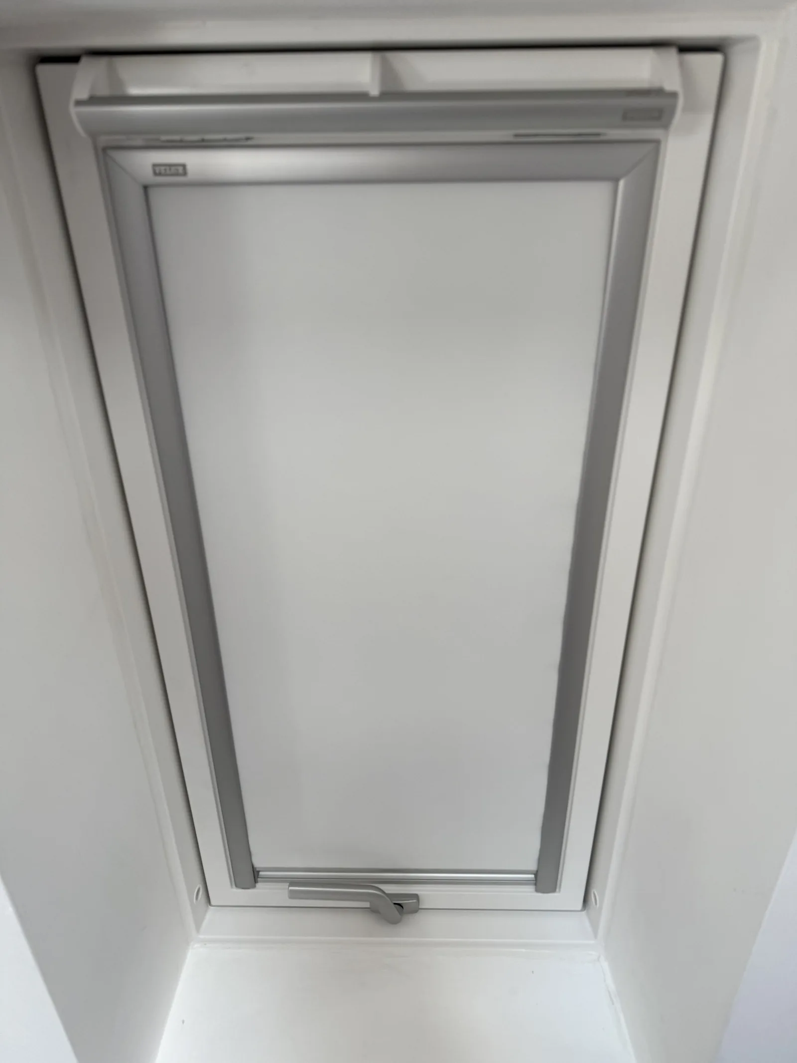 VELUX roof window in a white-painted interior