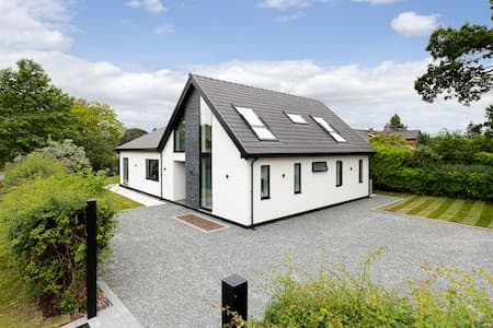 House exterior with two roof windows on a pitched roof